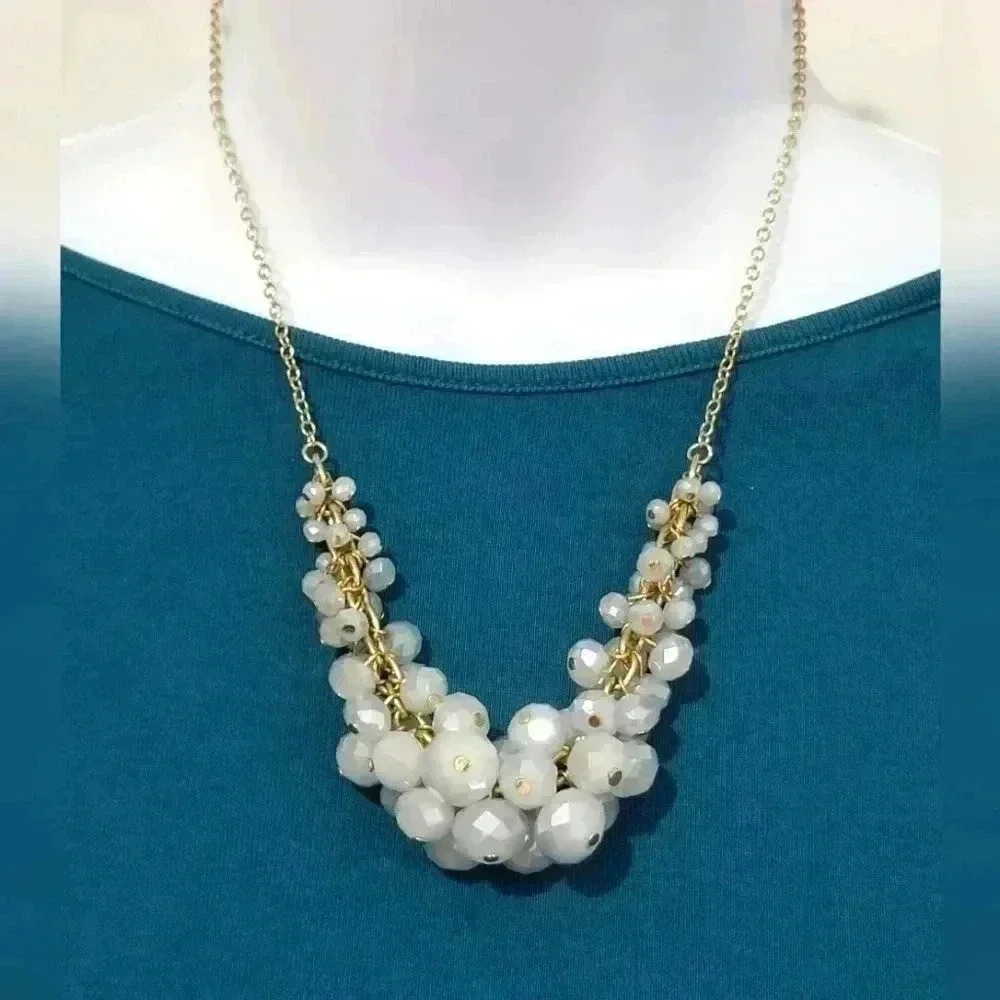 Adjustable gold tone necklace with faceted beads